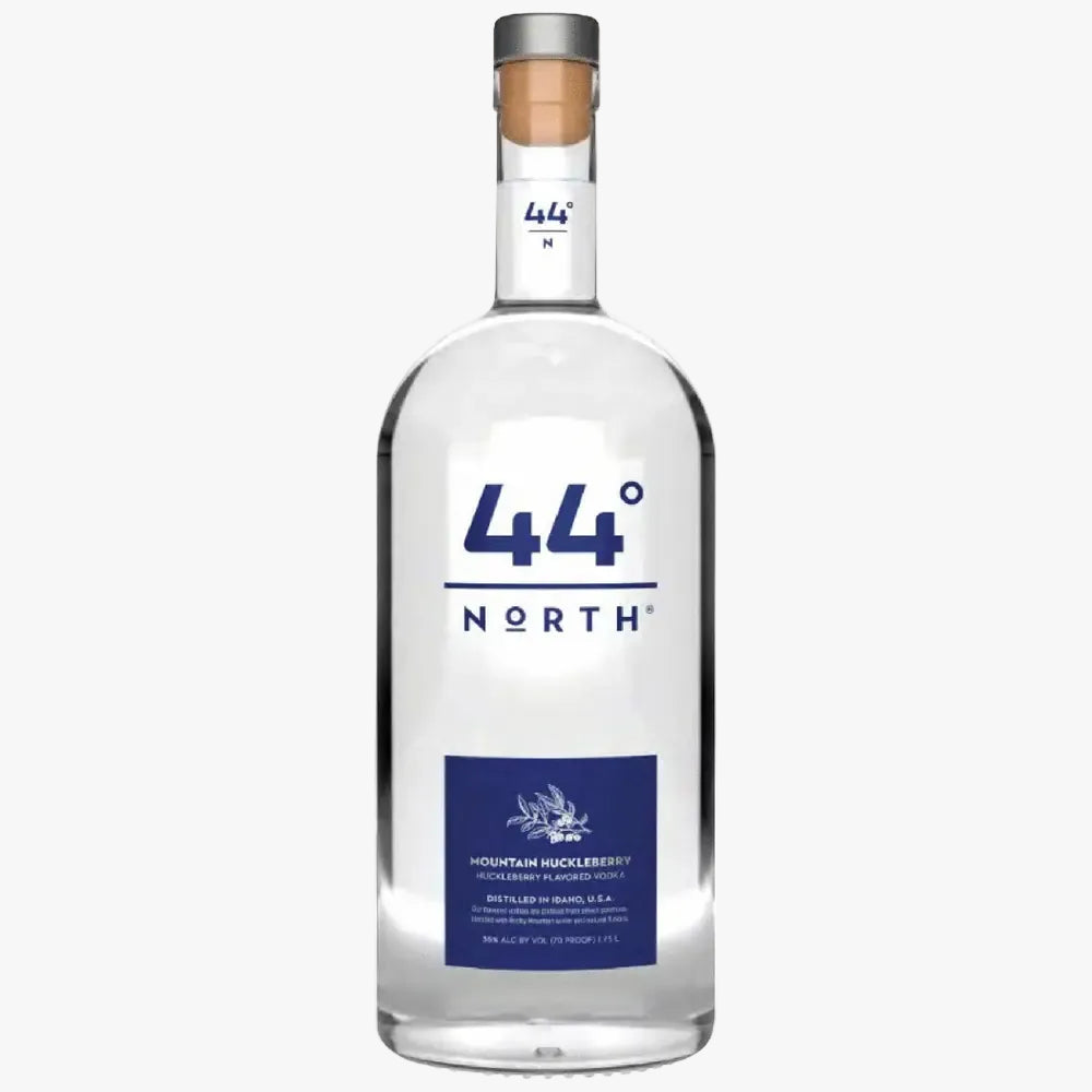 A bottle of 44° North Mountain Meadow Spirit vodka on a solid white background. The bottle is clear glass with a white and blue label, a silver metal cap, and a cork stopper.