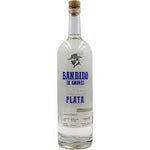 A clear glass bottle of Bandido El Marino Plata tequila with a white label featuring blue text and a gold cork, set against a plain white background.