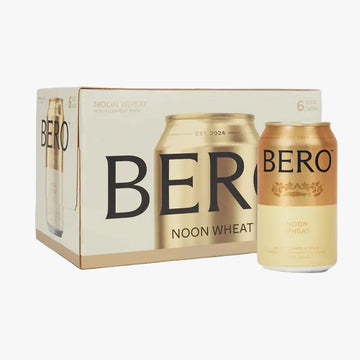 Packaging of Bero Noon Wheat beer cans on a light gray background