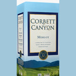 A 3-liter box of Corbett Canyon Merlot wine, featuring a light blue and white design with a vineyard illustration and a gold seal. The packaging is shown next to a vertical blue panel labeled 'Merlot' and a dark blue panel labeled '1 CT 3L'.