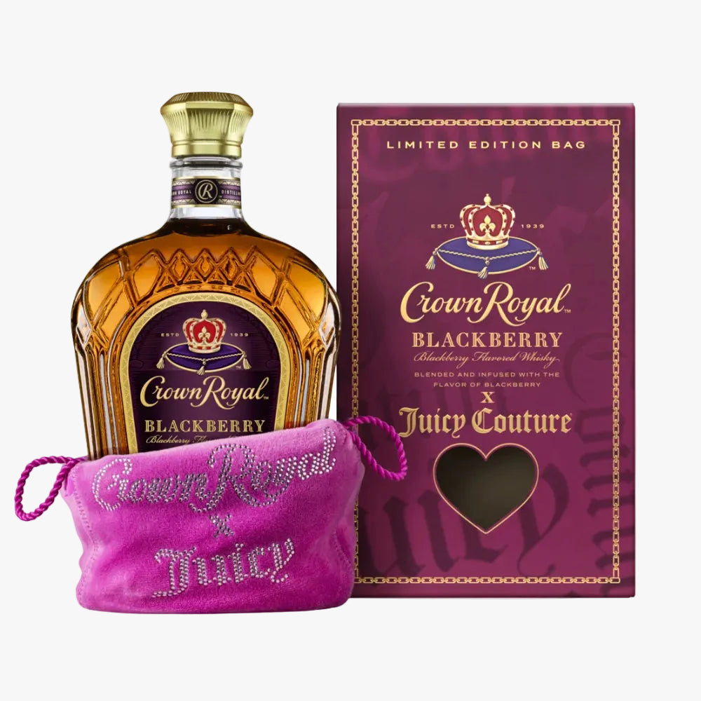 Crown Royal Blackberry flavored whisky bottle displayed next to its purple limited edition packaging box and a pink rhinestone-covered drawstring pouch.