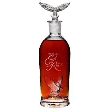 A clear glass decanter filled with amber liquor, featuring a sculpted silver eagle perched on the shoulders of the bottle and etched text reading 'Double Eagle Rare' on the front, set against a plain white background.