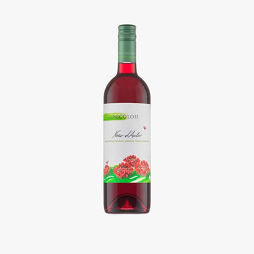 A bottle of red wine with a white label featuring green and red graphics, including the brand name 'NICOLOSI' and 'Mar Adriático'.