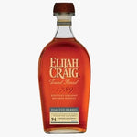 A bottle of Elijah Craig Toasted Barrel Kentucky Straight Bourbon Whiskey, showing the amber liquid inside a clear glass bottle with a dark brown wooden cap and a gold and blue label.