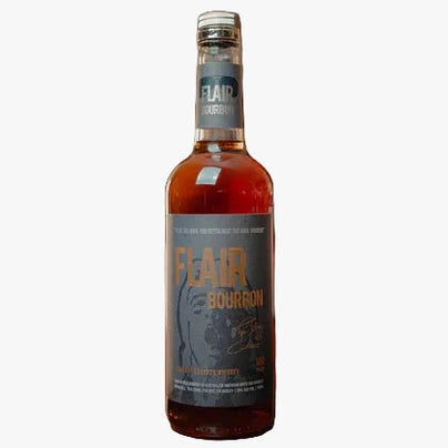 A bottle of Fear Bourbon whiskey stands on a wooden bar counter next to a small glass with amber liquid, with blurred liquor shelves in the background.