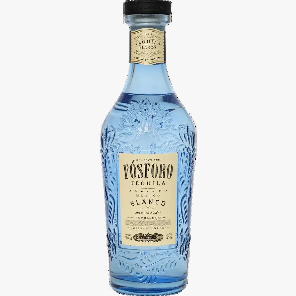 A bottle of Vósforo Tequila Blanco tequila, featuring a light blue glass bottle with embossed floral details, a cream-colored label, and a black cap, shown against a plain white background.