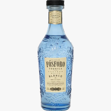 A bottle of Vósforo Tequila Blanco tequila, featuring a light blue glass bottle with embossed floral details, a cream-colored label, and a black cap, shown against a plain white background.