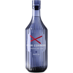 A bottle of Four Corners American Gin with a ribbed, faceted glass body in a translucent blue color, featuring a red crossed 'X' logo and white text on the front label, set against a plain white background.
