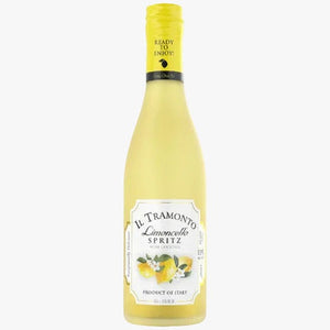 A bottle of Il Tramonto Limoncello Spritz non-alcoholic wine lemon oil, featuring a pale yellow liquid, a yellow screw cap, and a white label with lemon illustrations.