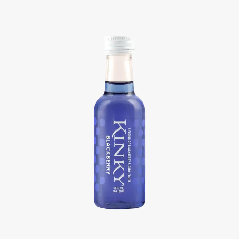 A small glass bottle of Kinky Blackberry liqueur with a translucent blue body, white cap, and white text, set against a pale peach background on a white surface.