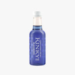 A small glass bottle of Kinky Blackberry liqueur with a translucent blue body, white cap, and white text, set against a pale peach background on a white surface.