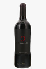 A bottle of Bloodlines Cabernet Sauvignon red wine by the brand Flask, featuring a black label with a red circular logo and white text, set against a plain white background.