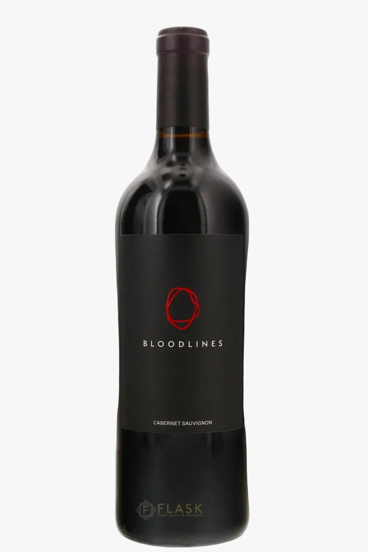 A bottle of Bloodlines Cabernet Sauvignon red wine by the brand Flask, featuring a black label with a red circular logo and white text, set against a plain white background.