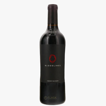 A bottle of Bloodlines Cabernet Sauvignon red wine by the brand Flask, featuring a black label with a red circular logo and white text, set against a plain white background.