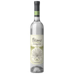A bottle of Palomo 100% agave spirituous liquor on a solid white background.