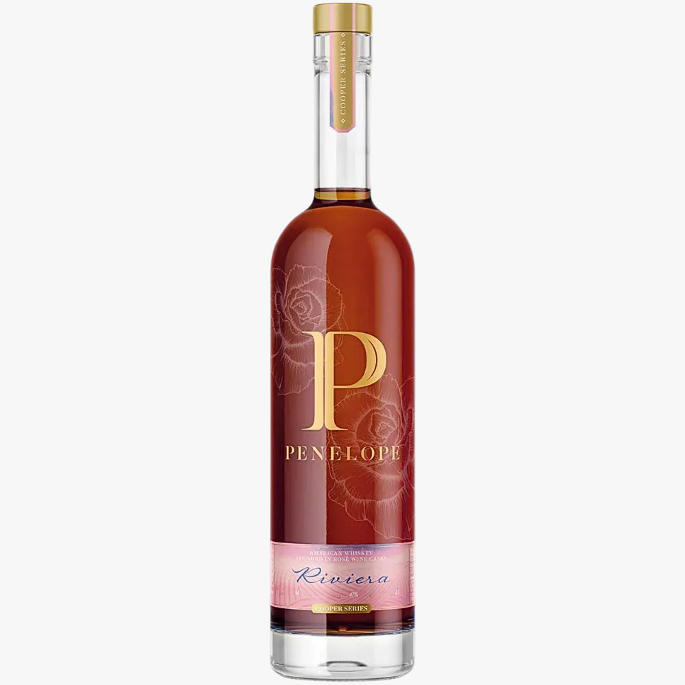 Penelope Bourbon bottle with gold cap and label on a white background