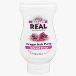 A 500 mL squeeze bottle of Simply Sourced Dragon Real Infused Exotics Dragon Fruit Puree Infused Syrup, featuring a white bottle with a pink and black label and an illustration of sliced dragon fruit.
