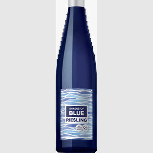 Blue wine bottle with a silver cap and white label on a white background