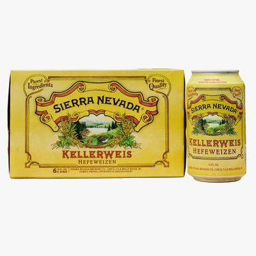 A yellow carton and matching can of Sierra Nevada Kellerweis Heifeweizen beer displayed on a wooden table with a blurred garden background.