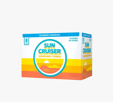 A box of Sun Cruiser Lemonade + Vodka blueberry lemonade, 8 count, featuring a retro sunset gradient design in blue, yellow, and orange on a white background.