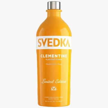 A bottle of Svedka Clementine Flavored Vodka in a bright orange-yellow color, featuring a white label with orange and white text, and a silver cap, set against a plain white background.