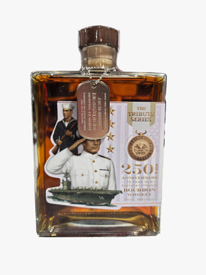 Bottle of Johnnie Walker Blue Label whisky with a label featuring a person and text on a textured surface.
