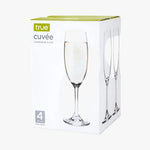Box of true cuveé champagne flutes with a glass of champagne on a white background