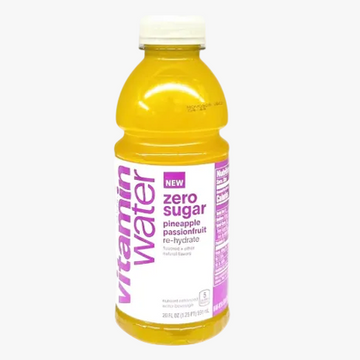 A 20 fl oz bottle of Vitamin Water Zero Sugar Pineapple Passionfruit rehydrate beverage, featuring a bright yellow-orange liquid, a white cap, and a white label with purple text and graphics, set against a plain white background.