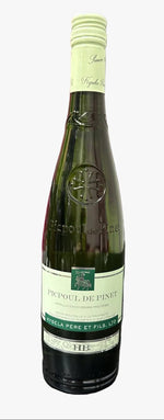 A bottle of Coèle des Rosés D'Anjouvin Cuvrier de Pinet dry wine, standing on a dark tabletop with pink branded boxes stacked in the background on a metal shelf.